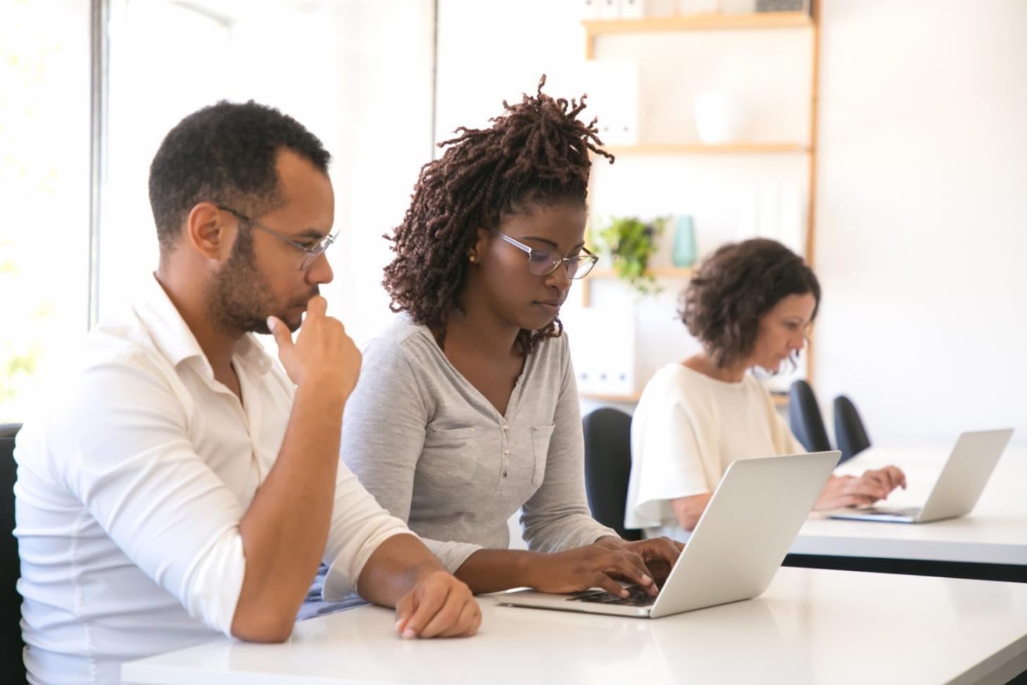 Person reviewing financial documents with coffee